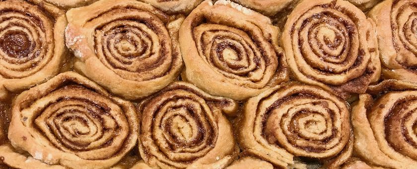 Cinnamon buns on a baking tray