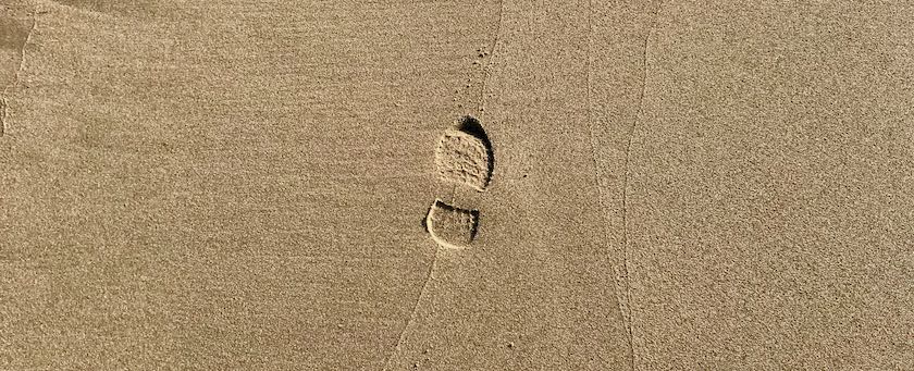 A single footstep in the sand