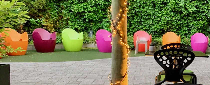 A few artful, yet simple outdoor chairs (seen in a hotel courtyard)