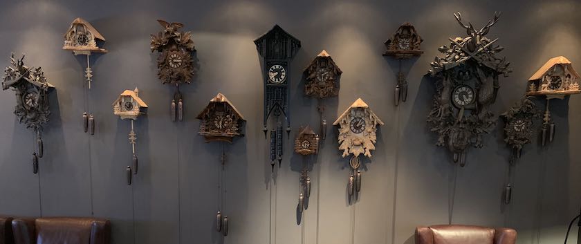 Wall with several cuckoo clocks (seen in a hotel lobby in southern Germany)